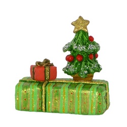 Two wrapped gifts with small Christmas tree