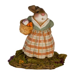 Missus Bunny carries a basker of seasonal root veggies