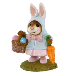 Girl mouse in rabbit coat with Easter basket and carrot