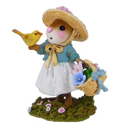 Young lady mouse with basket of flowers in one hand and a bird on the other