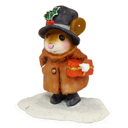 Mouse with top hat and overcoat carring a Christmas package through the snow