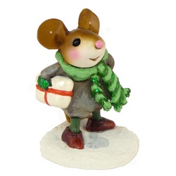 Youg mouse with scarf trecking through snow holding package