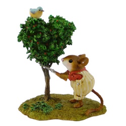 Gardener mouse trims heart shaped tree with blue bird on top