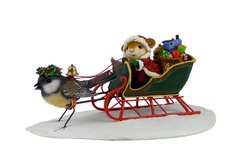 Mouse Santa in sleigh with toys pulled by a bird