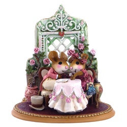 Mouse couple in fall Victorian dress sit at a table looking at a diamond ring