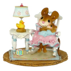Mother mouse in a rocking chair with baby on her knee