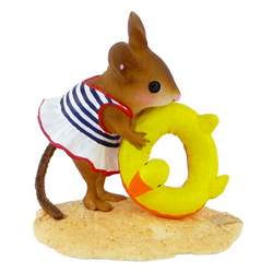 Girl mouse in a swim suite with duck ring