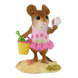 Girl mouse in floral swim suite with bucket, spade and conch shell