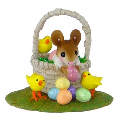 Girl mouse in side a basket with Easter eggs and little chicks