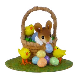 Boy mouse in Easter basket with Easter eggs and chicks