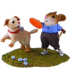 Boy mouse throughs a fisby for his dog