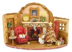 Indoor Chistmas seen with fireplace, cat on chair and mouse mouse decorating tree