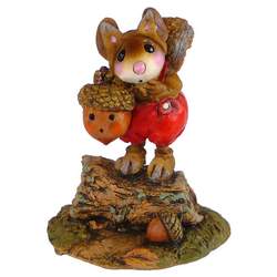 Mouse with squirrel costume holding acorn lamp