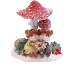 Two mouse elves share a delightful Christmas treat under a red mushroom.