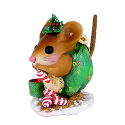 Curled up mouse in Christmas attire nibbles on tasty treats