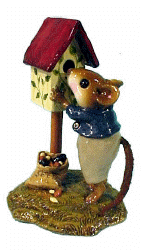 Boy mouse looking into a birdhouse 