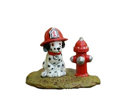 Dalmation with fire hat by hydrant