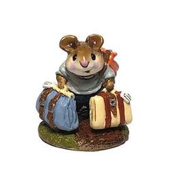 Mouse with his bags packed and ready to go.