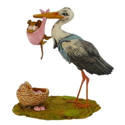A Stork about to place a  baby mouse to a basinet
