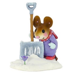 Mouse with large snow shovle looking at a spring flower