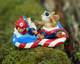 Babies enjoying their floaties decked out in all their Fourth of July best! Back side