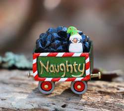 The Christmas train is arriving with a cart stocked full of coal and a cute penguin for those on Santa's 