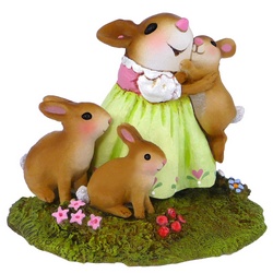 Girl mouse cuddles a rabbit with two other standing by