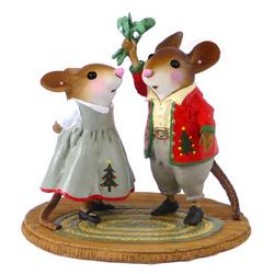 Mice couple christmas attirer male holding up mistletoe
