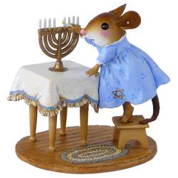 Girl mouse lighting a menorah