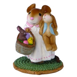 Young girl mouse holding a bunny and a basket of Esater goodies
