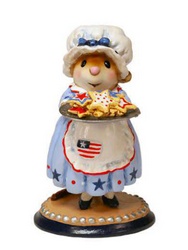 Mrs. Clause is serving up her classic cookies, red, white and blue style! She is wearing her best stars and stripes 