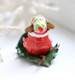 Samta Mouse on a holly leave slay back view