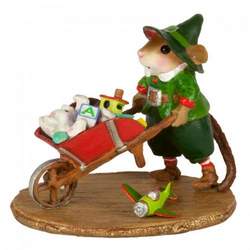 Santa's helper with toys in a wheelbarrow