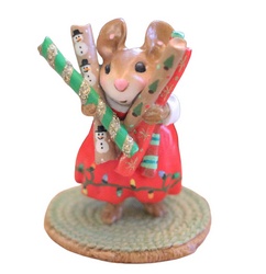 Female mouse with her Cristmas wrapping paper