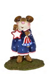 Young female mouse rings in the Fourth of July with red white and blue colored decorations 