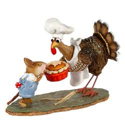 Turkey chef holds pie with helpful young mouse.