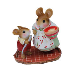 Little boy mouse likes the spoon as mom mouse makes holiday treats