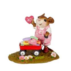 Girl mouse with red wagon full of Valentines treats.