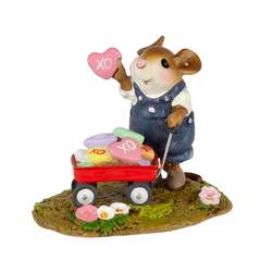 Boy mouse with red wagon full of Valentines treats.