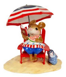 A good book and come cool watermelon under the shade of her patriotic umbrella makes for the perfect Fourth of July she just won't forget!