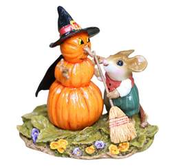 Mouse with broom clears up around the pumpkin Snowman