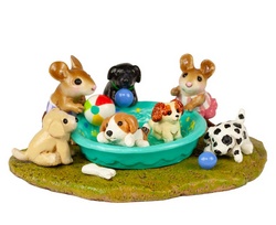 Kiddie pools aren't just for kids! A pool full of puppies splashing is guaranteed to bring joy.