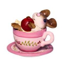 Baby mouse in a teacup with an apple