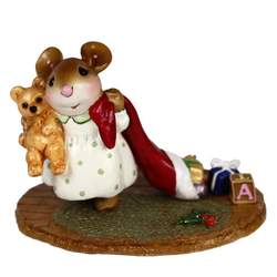 Miss Mouse holds her teddy and drags her stocking