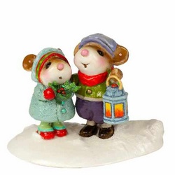 Two young mice carry a light and a merry greeting to all those they meet walking in the snow