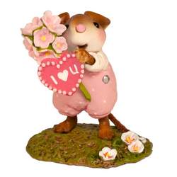 Mouse clutching beautiful pink flowers and a Valentine heart. 