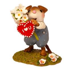 Mouse clutching beautiful pink flowers and a Valentine heart. 