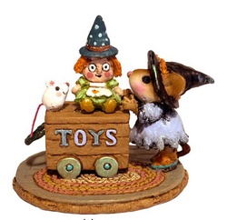 Girl mouse playing with her Halloween toys